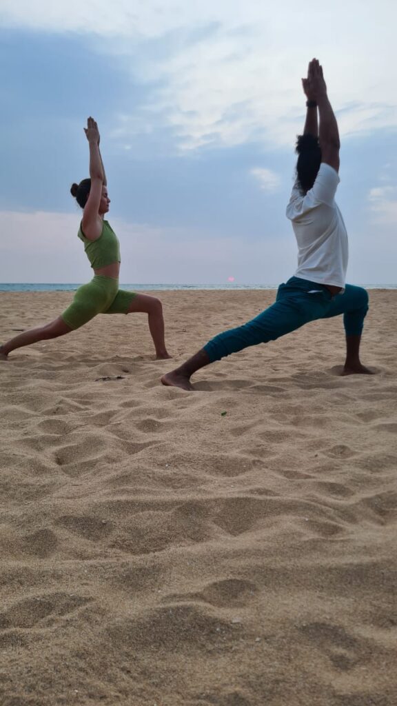 Small group yoga class on the beach near Bentota, Sri Lanka